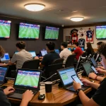 Bongdallu betting scene with active engagement on devices, showcasing live sports action and betting excitement.