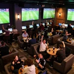 Socolive sports enthusiasts engaging in live betting action while watching thrilling soccer games.
